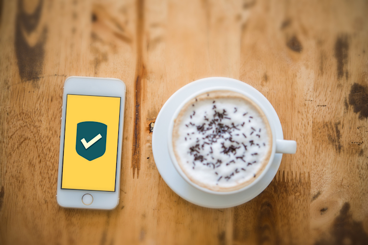 mobile-phone-security-shield-protection-data-flat-icon-on-screen-relaxing-in-cafe t20 zn2PQP