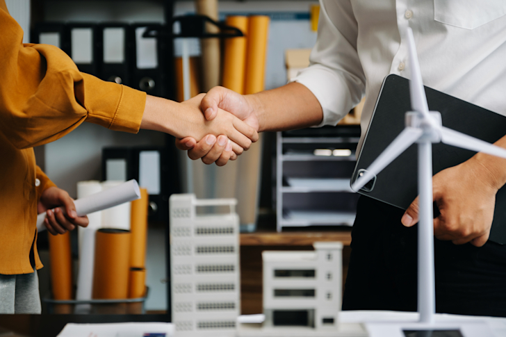 Ondernemers die handen schudden